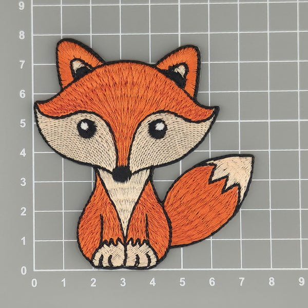 a close up of a patch of a fox